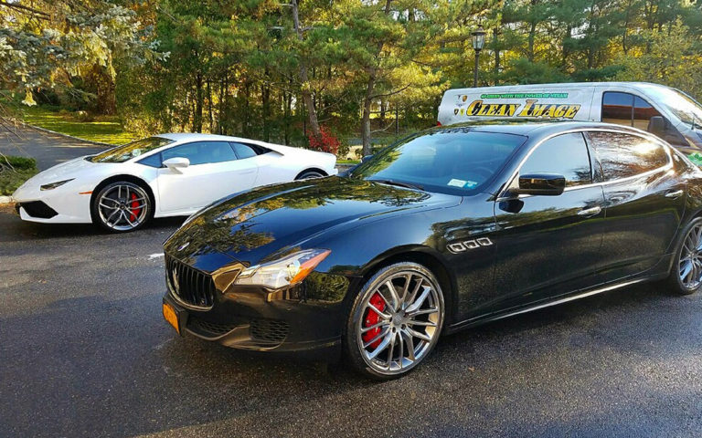 Black Maserati and White Lamborghini with Clean Image truck.