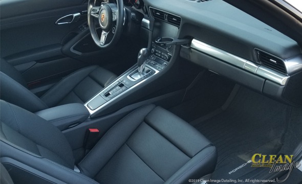 Black Porsche 911 interior freshly cleaned.