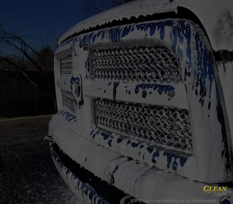 RAM truck grille in foam bath.