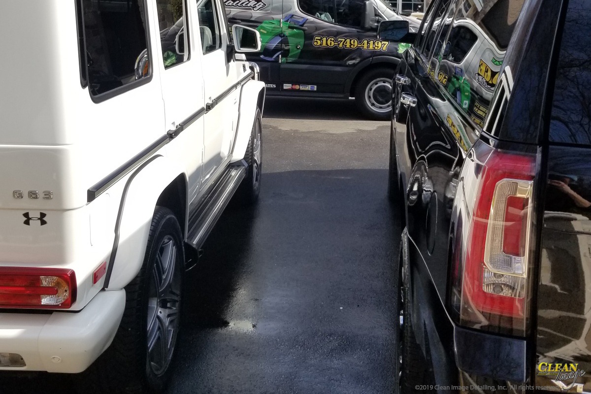 White Mercedes G-Wagon with Black Yukon after Executive Detailing.