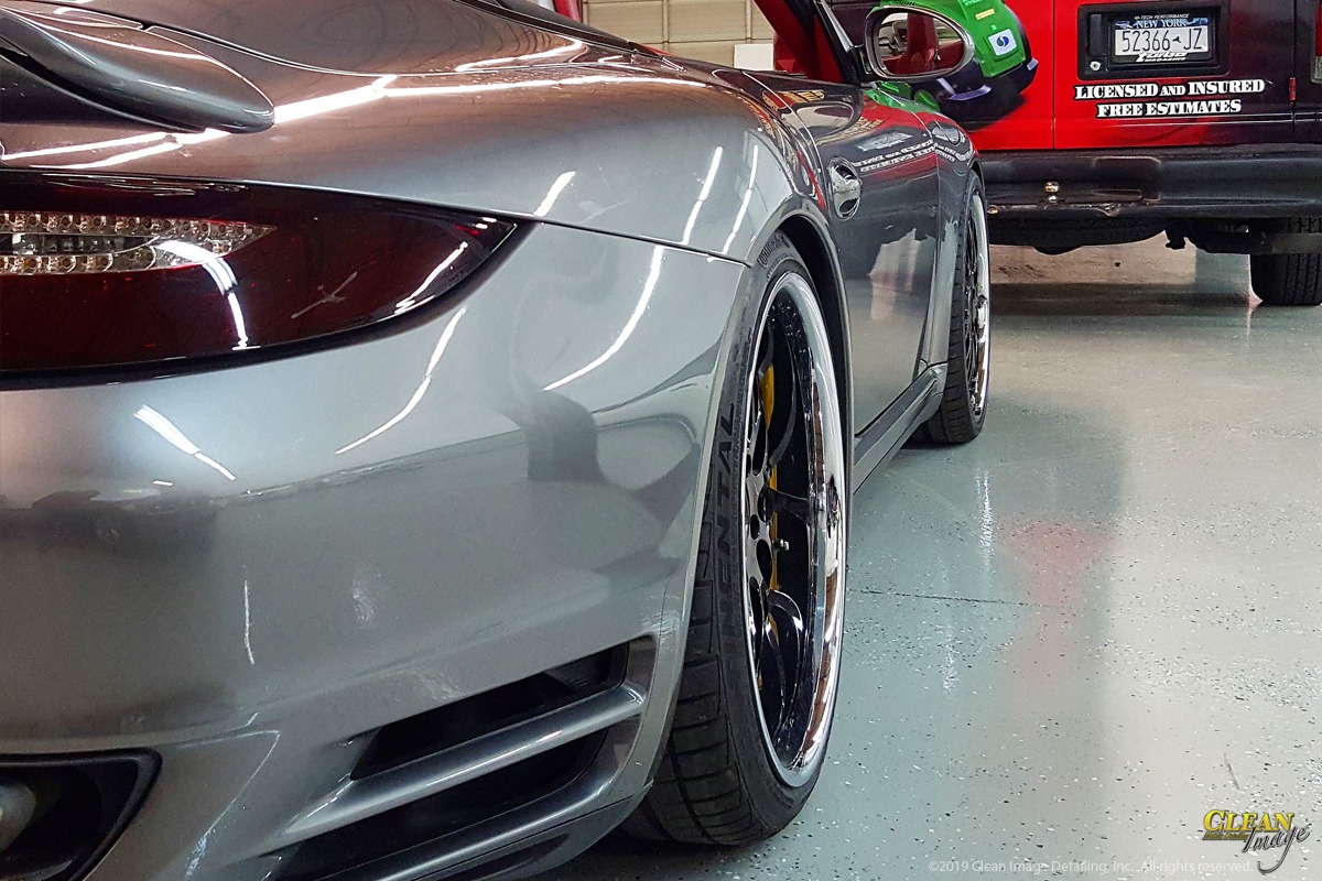 Silver Porsche 911 after pain correction service.