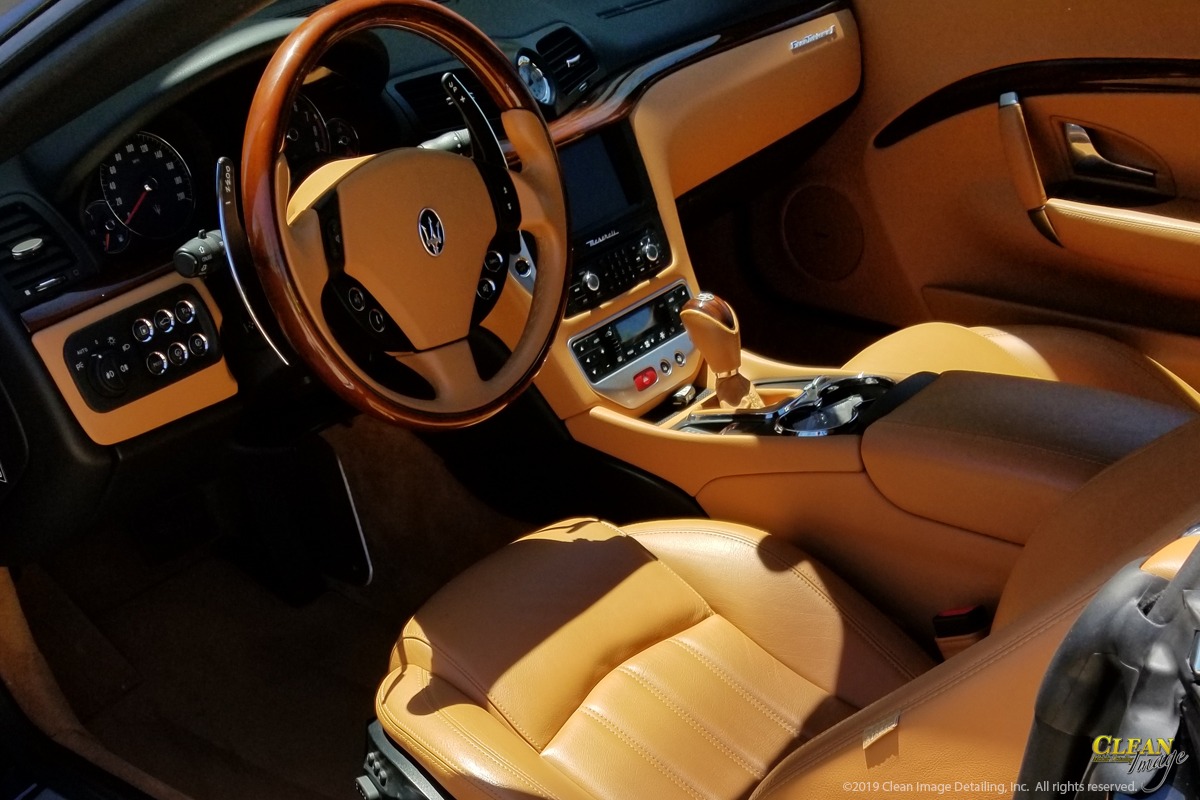 Steam cleaning Maserati interior.